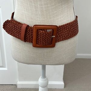 Never worn all leather warm brown belt with woven design.
